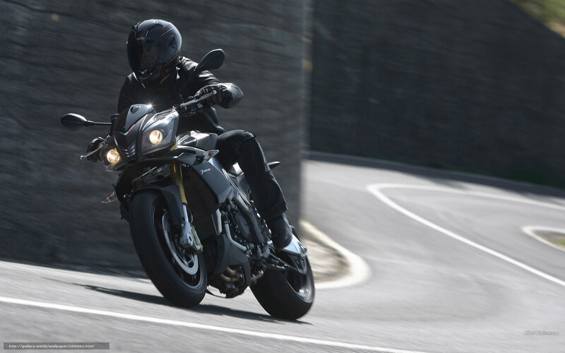 motorcycle rider on winding road