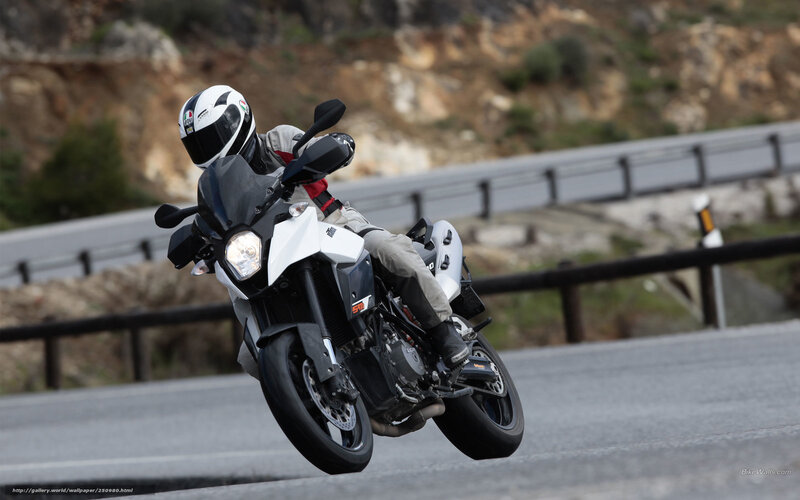 motorcycle rider on winding road