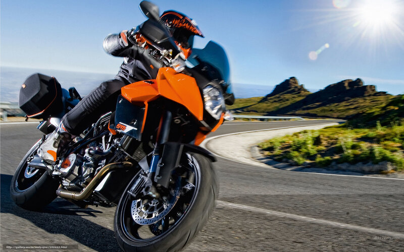 Motorcycle rider on winding road