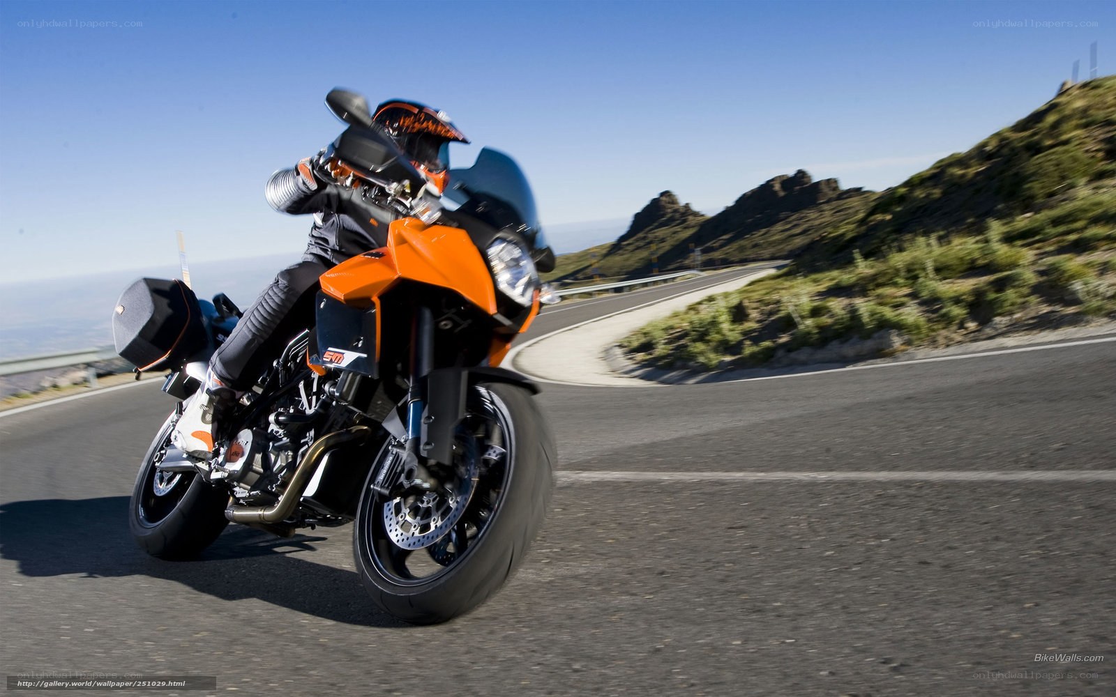 motorcycle rider on winding road