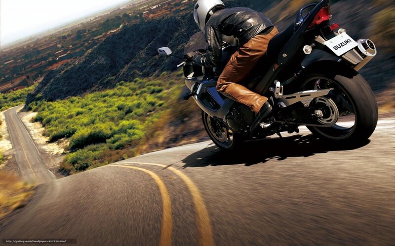 Motorcycle rider on winding road