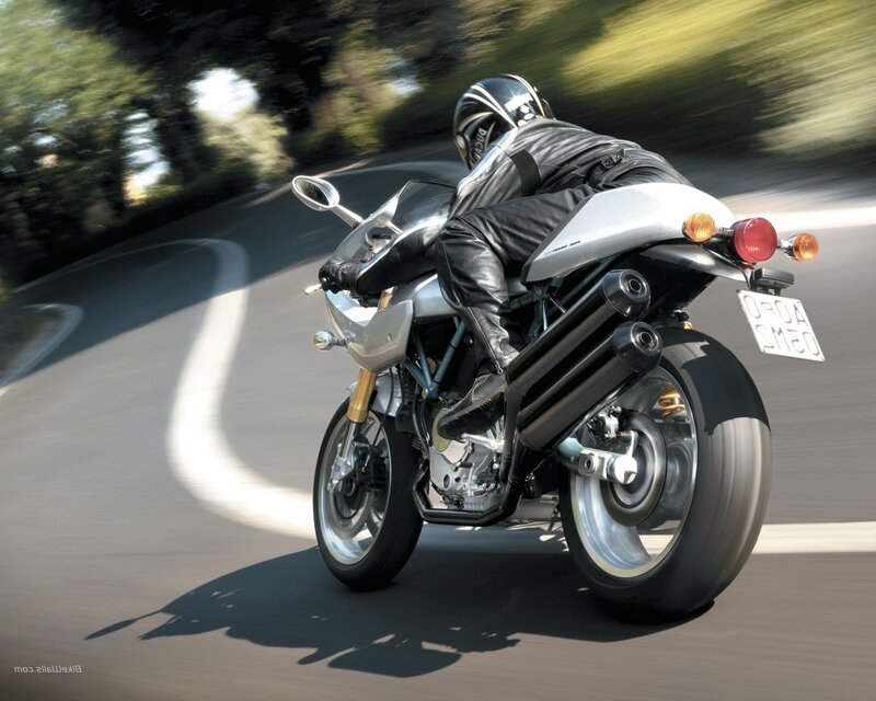 motorcycle rider on winding road