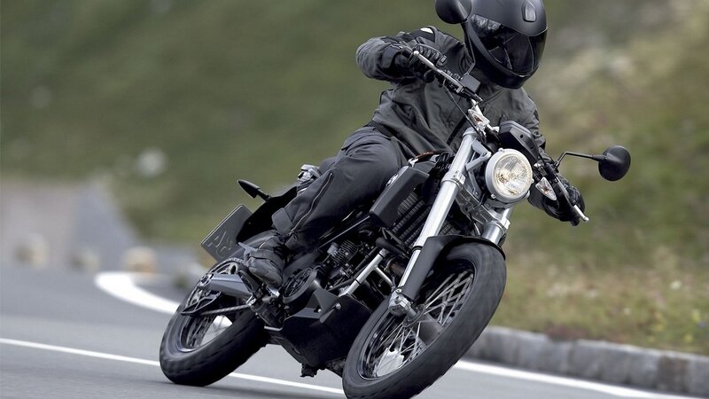 motorcycle rider on winding road