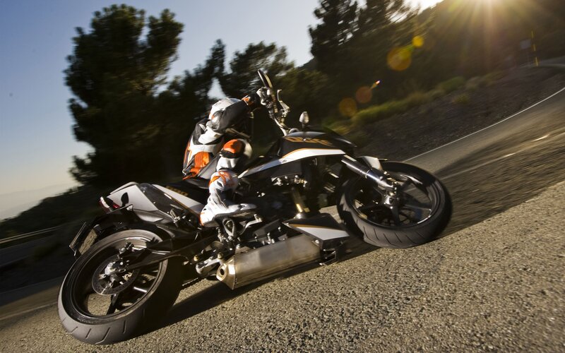 motorcycle rider on winding road