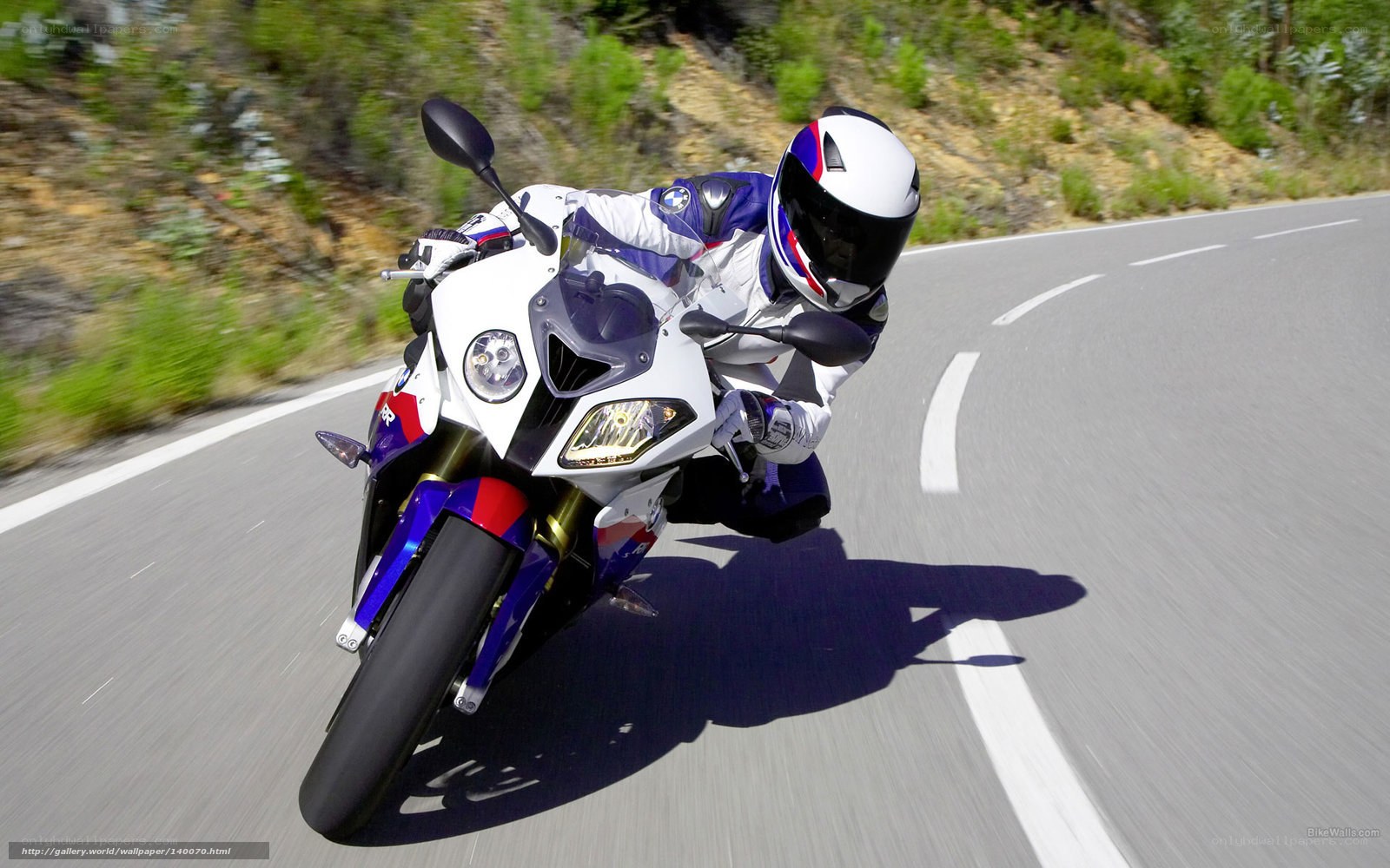 motorcycle rider on winding road