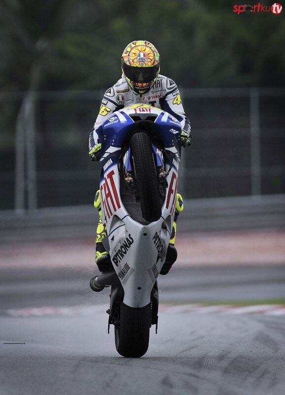motorcycle rider performing wheelie