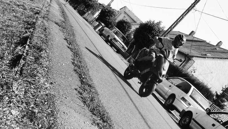 Motorcycle rider performing wheelie