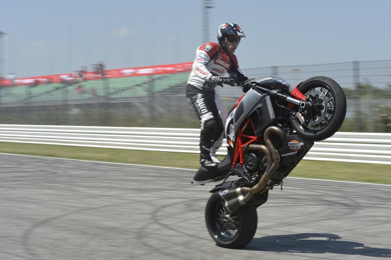 Motorcycle rider performing wheelie