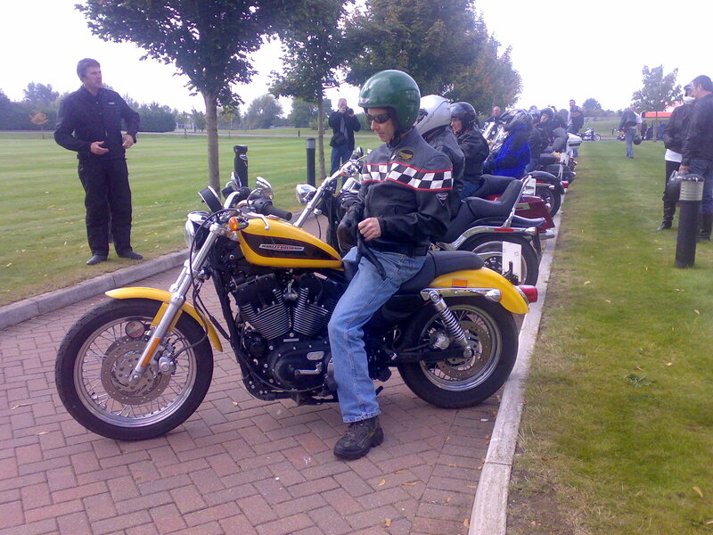 Motorcycle riders at a gathering