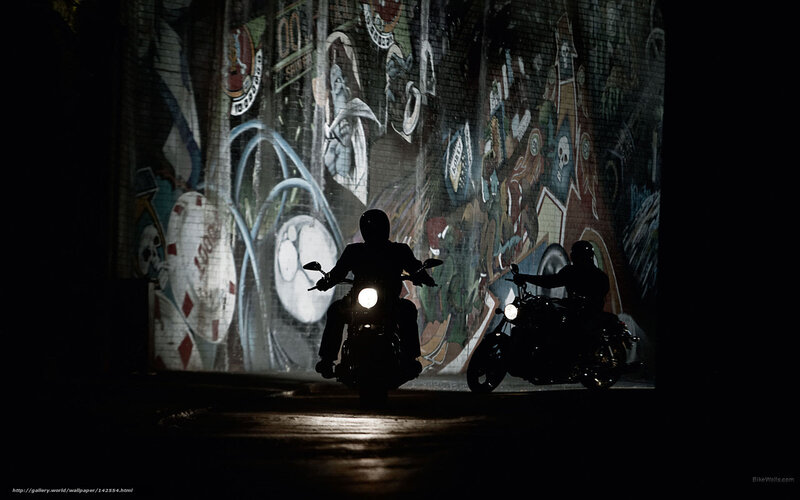 Motorcycle riders at night