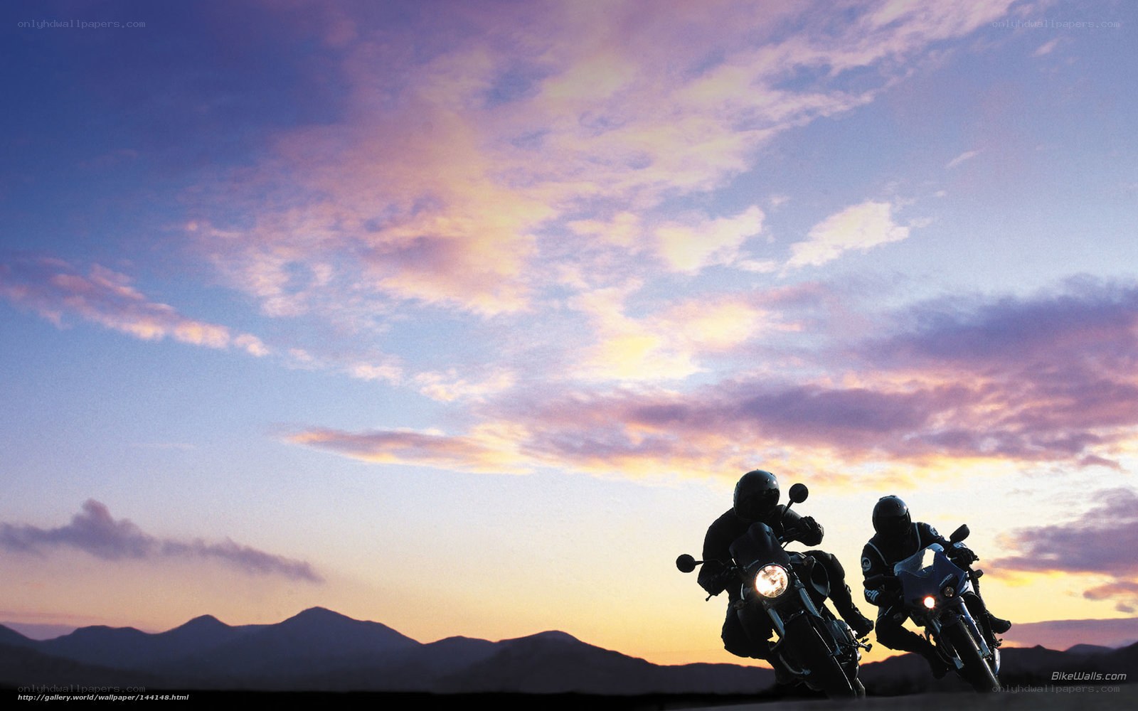 Motorcycle riders at sunset