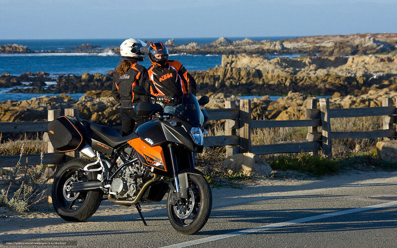 Motorcycle riders by the coast