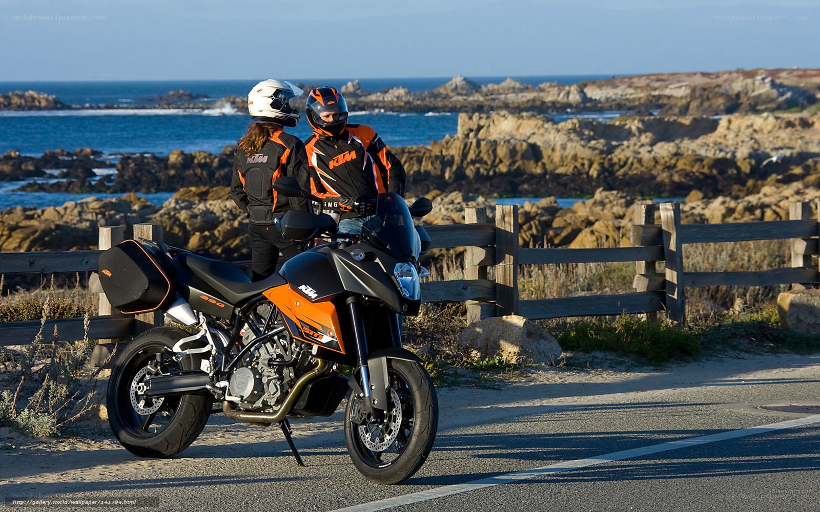 Motorcycle riders by the coast
