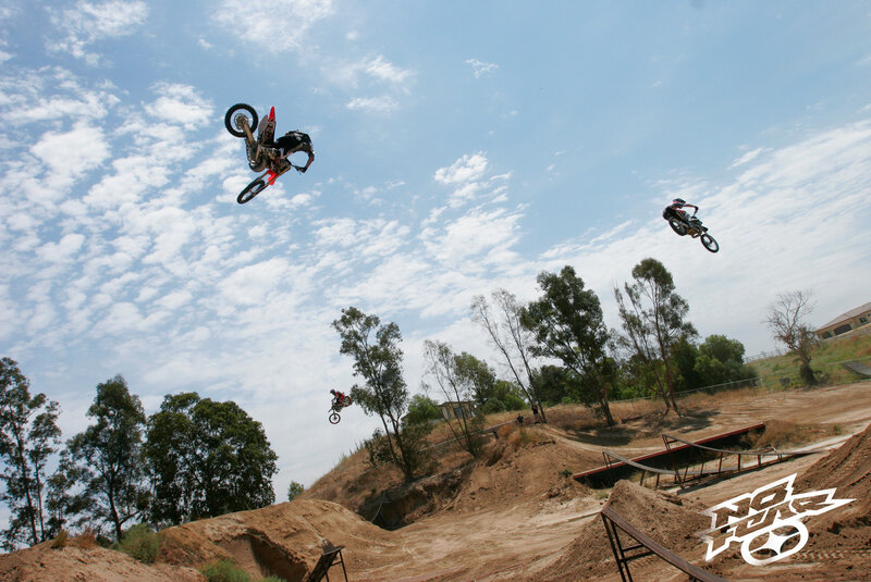 Motorcycle Riders in Mid-air