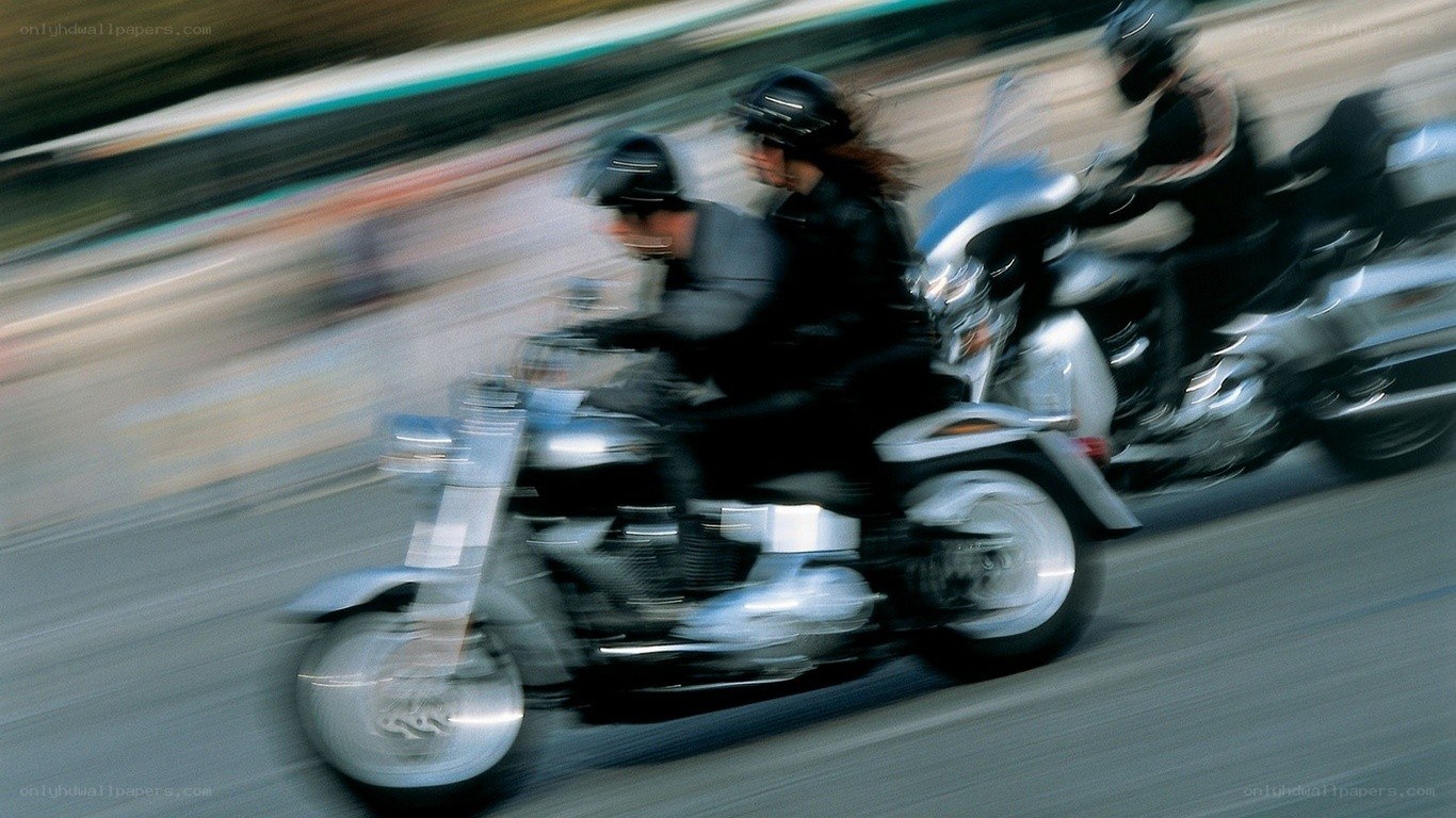 Motorcycle riders in motion
