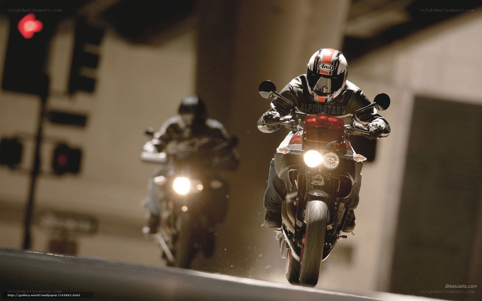 Motorcycle riders in tunnel
