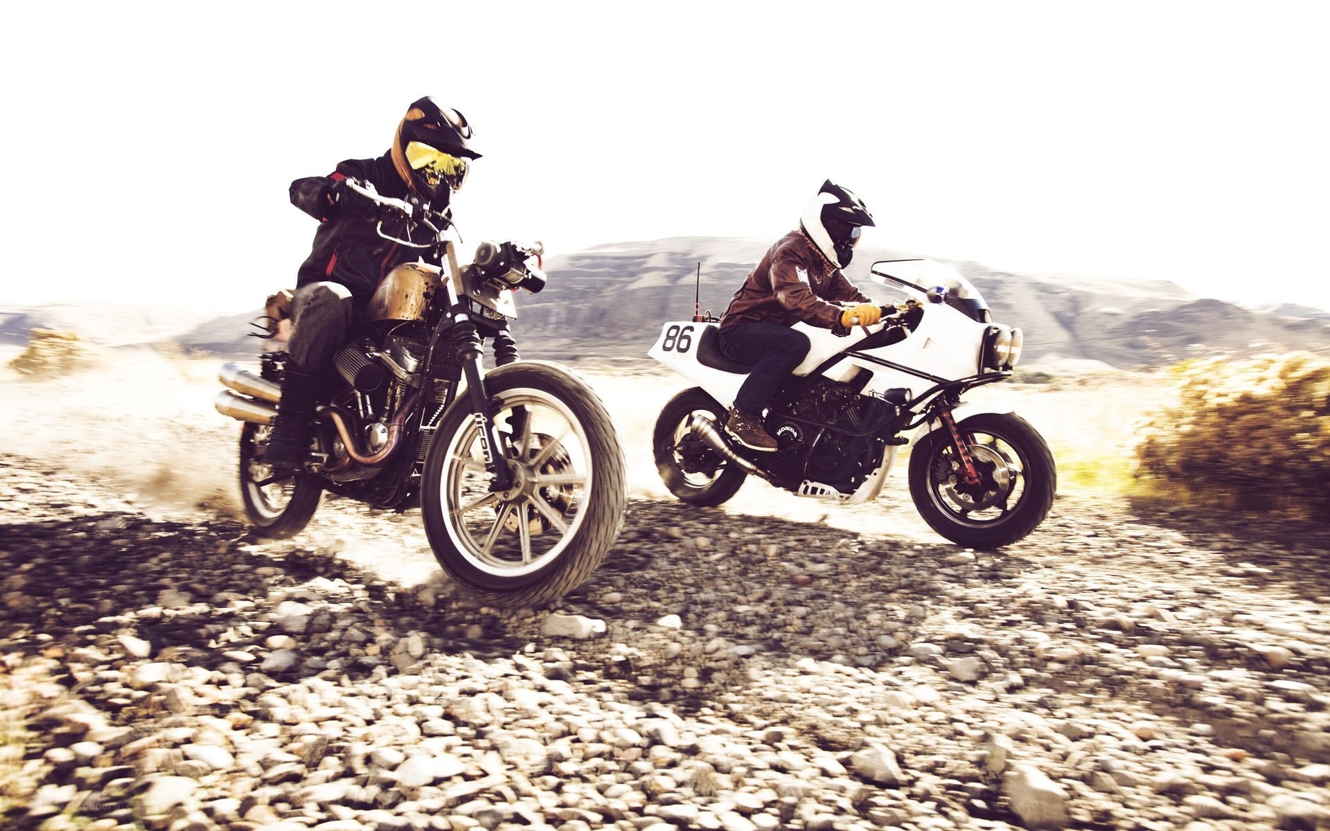 Motorcycle riders on a dirt road