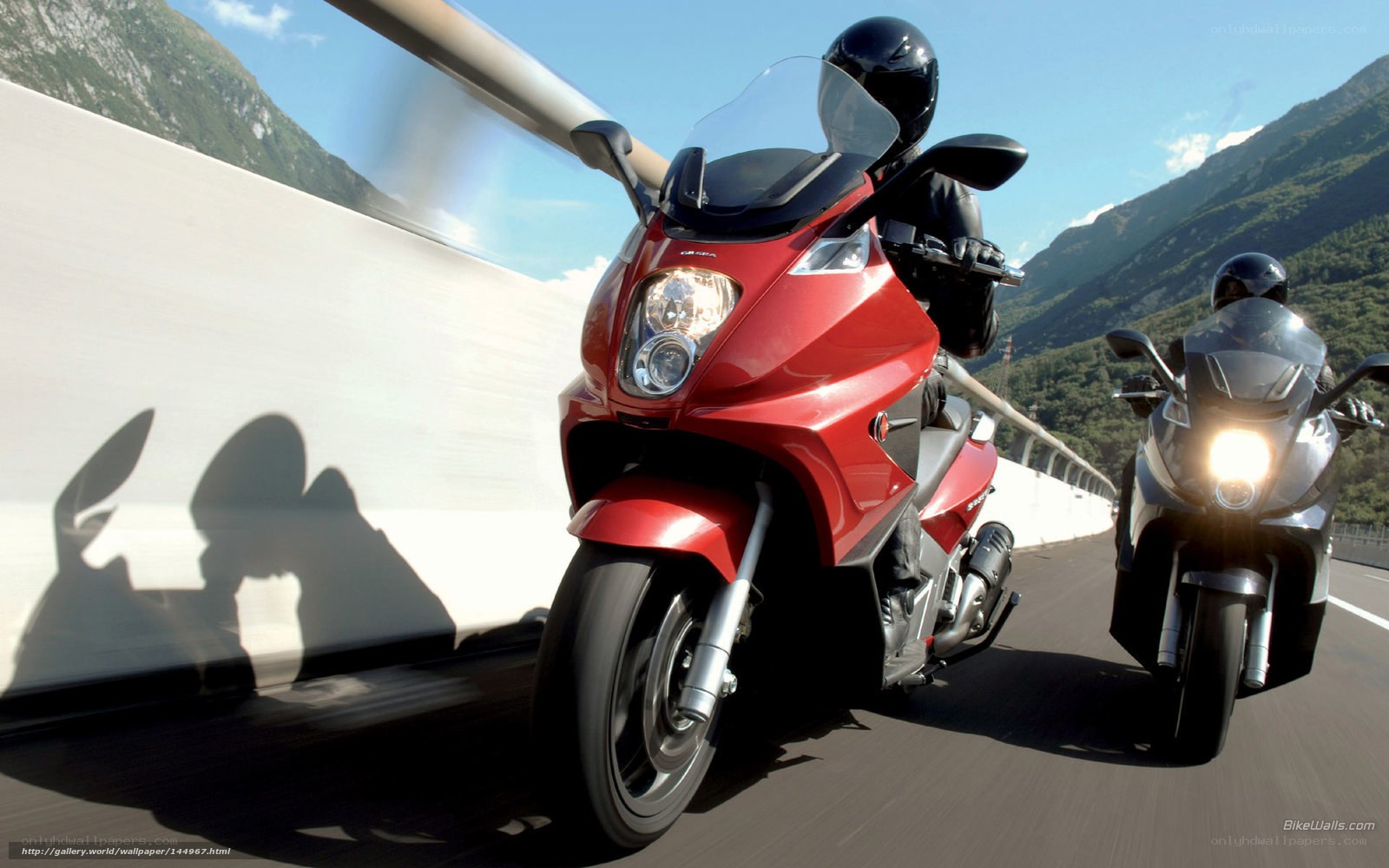 Motorcycle riders on a mountain road