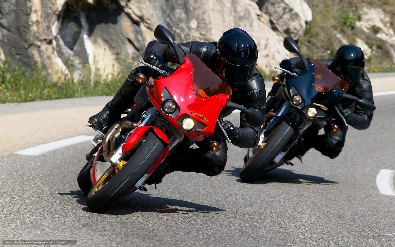 Motorcycle riders on a winding road