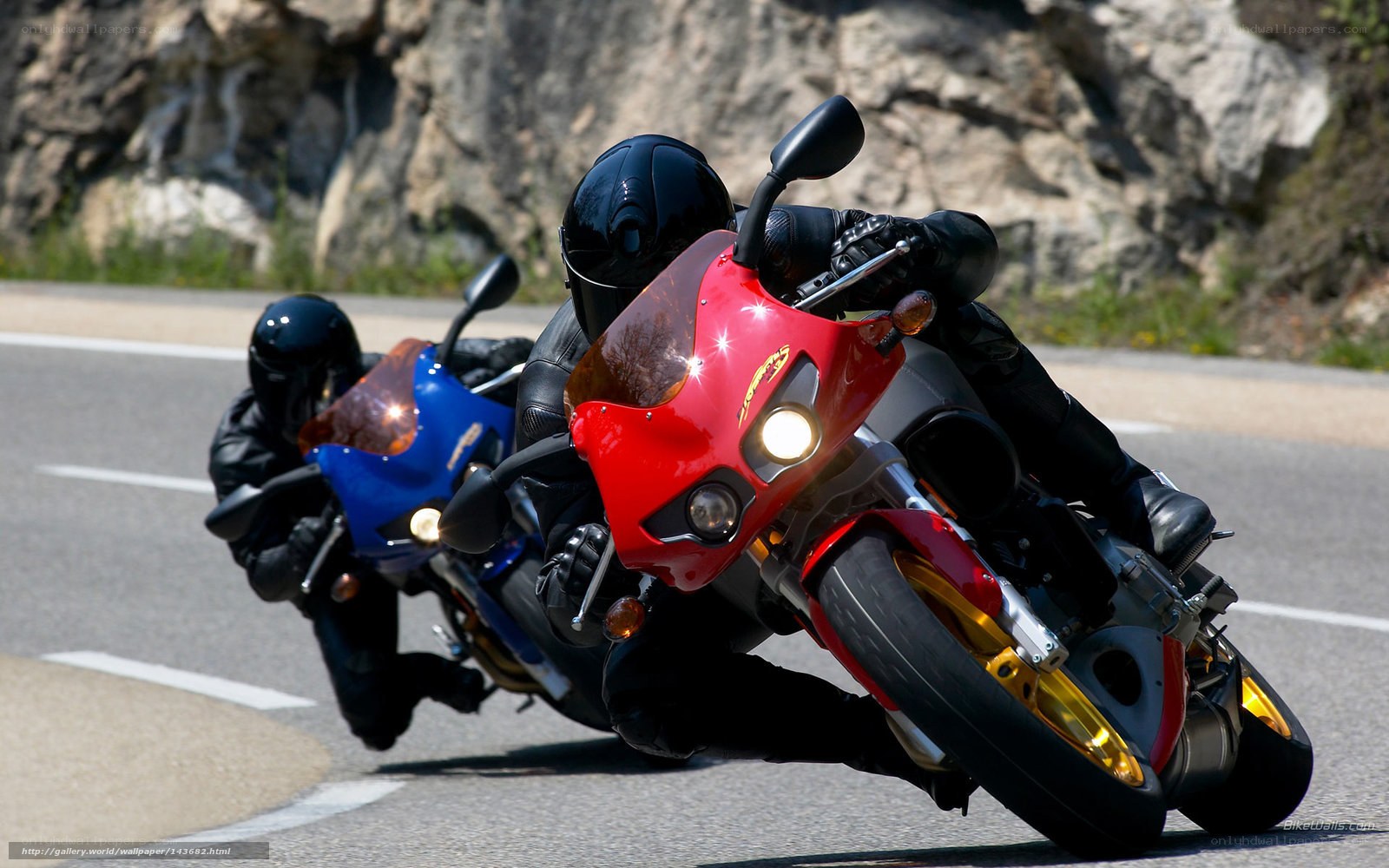Motorcycle riders on a winding road