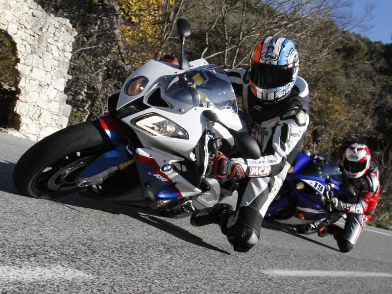 Motorcycle riders on a winding road