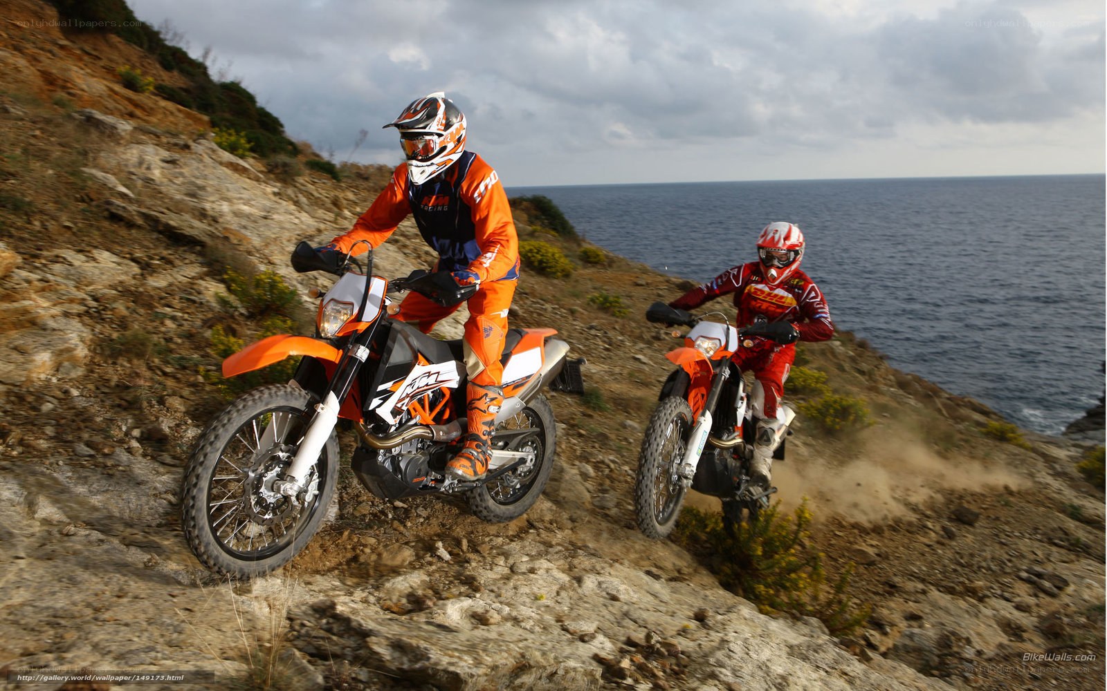 Motorcycle riders on coastal trail