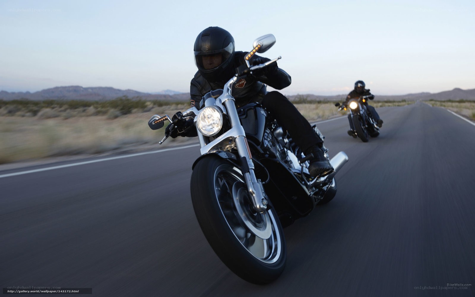 Motorcycle riders on desert road