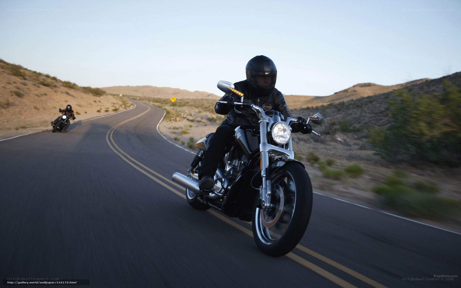 Motorcycle riders on desert road