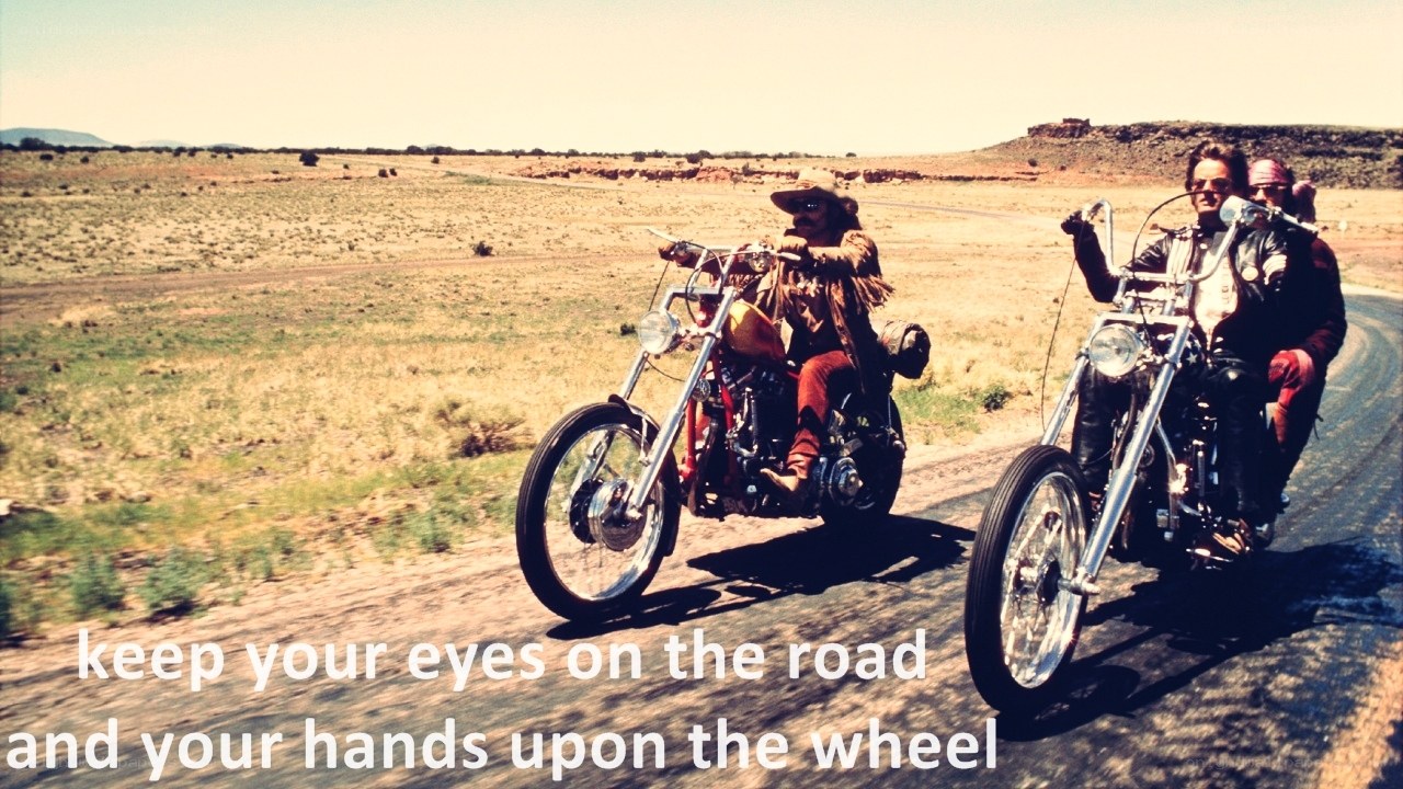 motorcycle riders on desert road