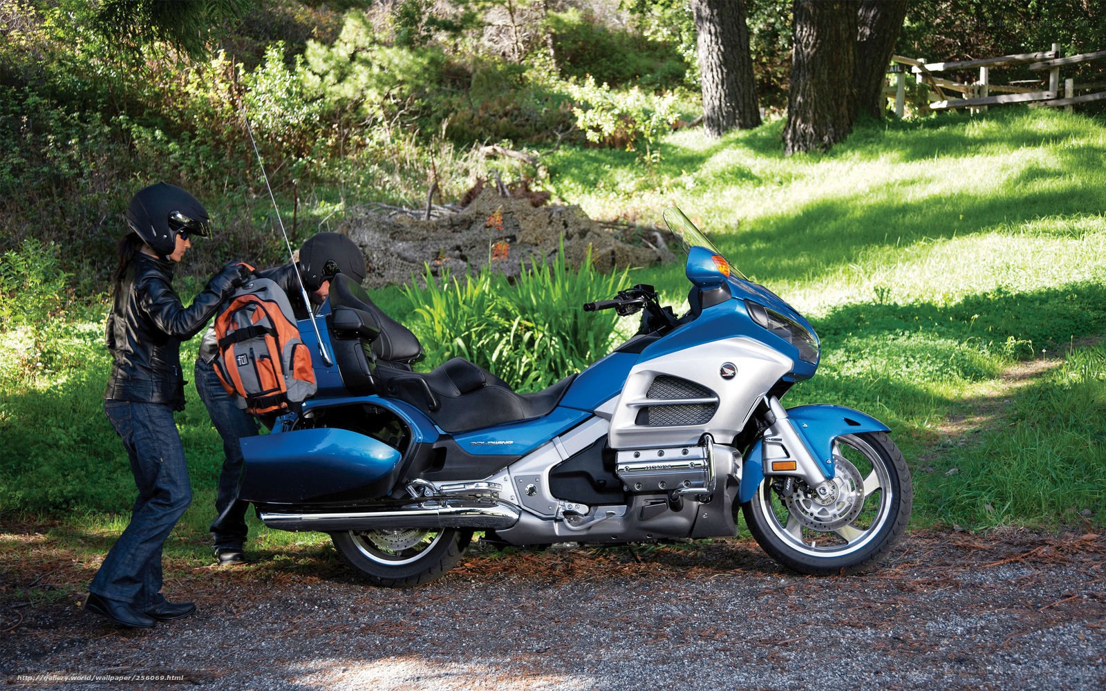 Motorcycle riders preparing for a trip