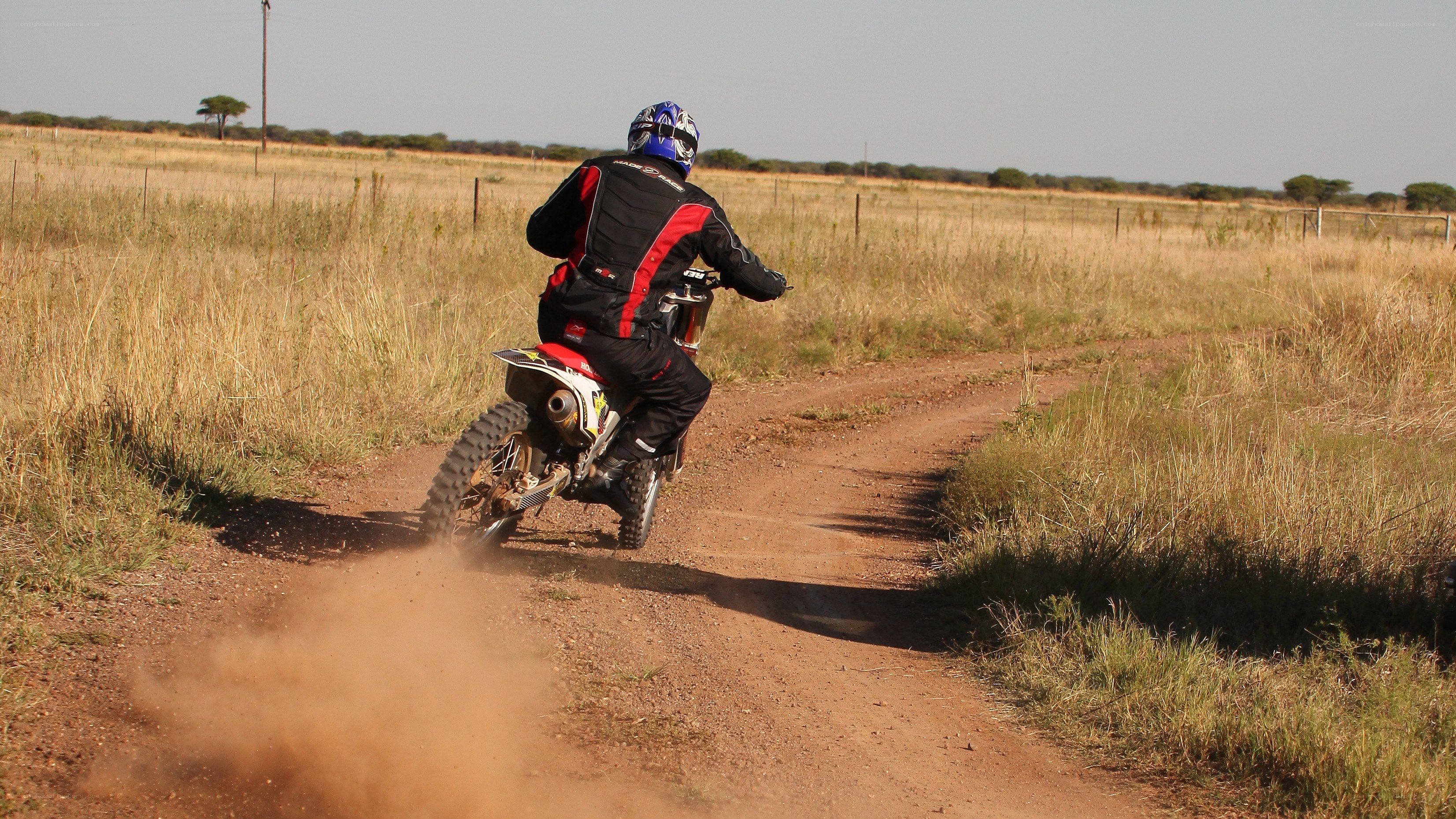 Motorcycle riding on a dirt path