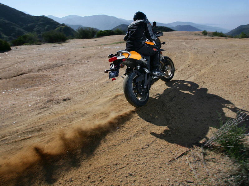 Motorcycle riding on dirt path
