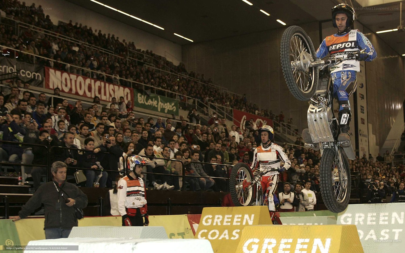 Motorcycle stunt at indoor arena