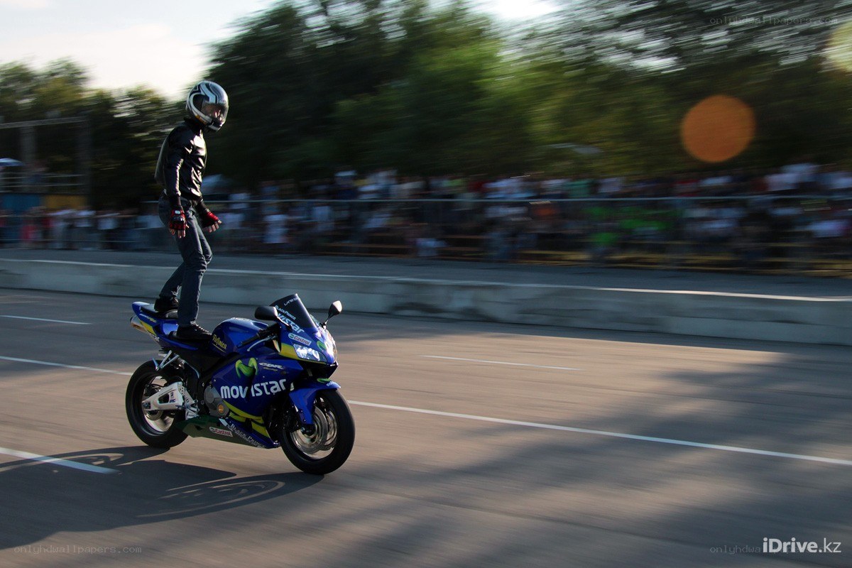 Motorcycle stunt on a track