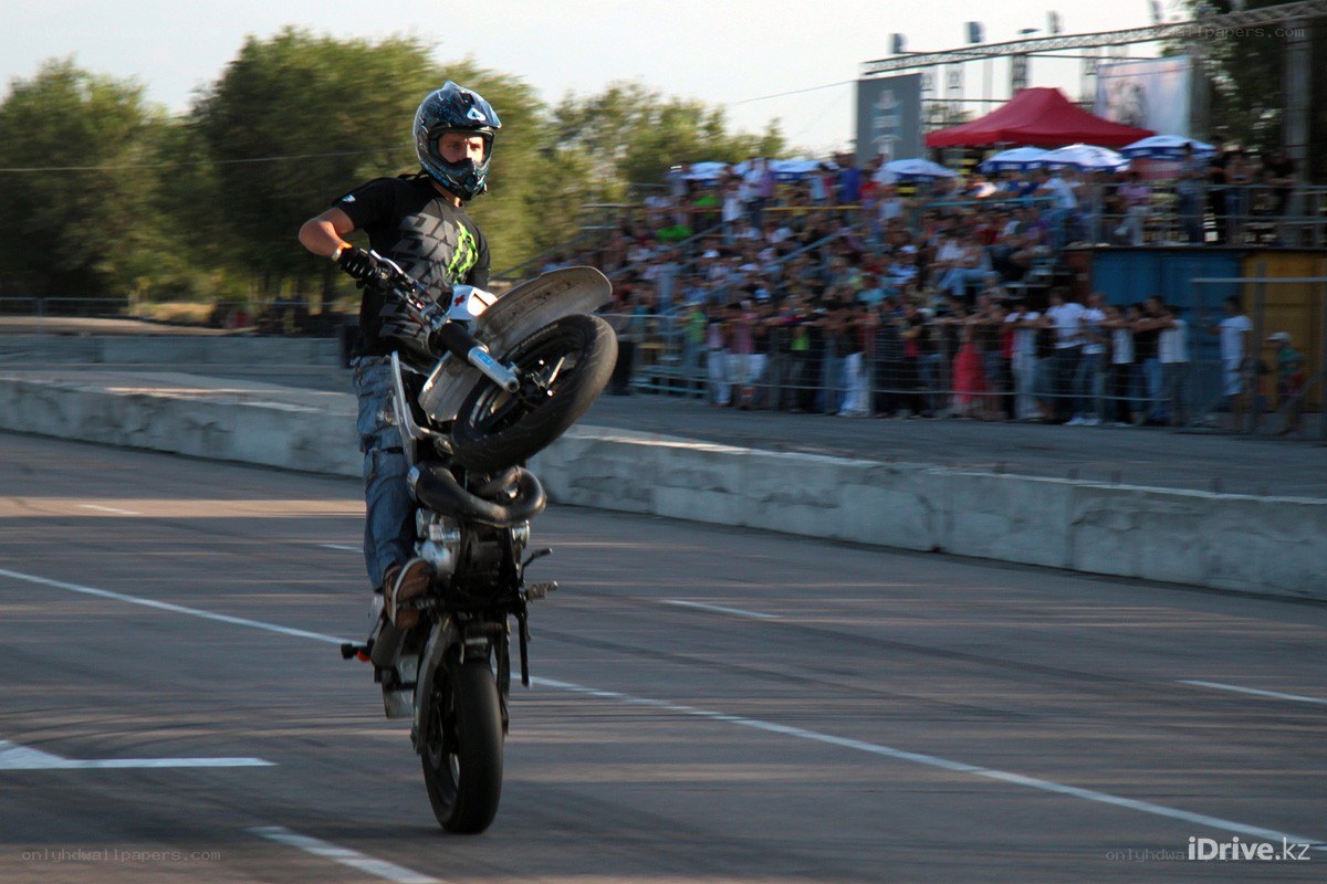 Motorcycle stunt on a track