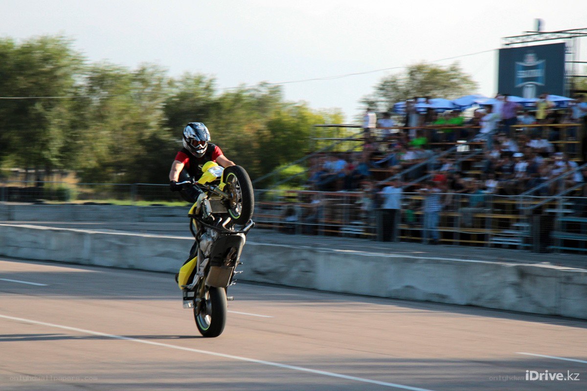 Motorcycle stunt on a track