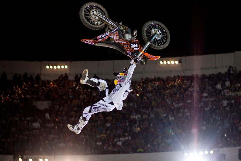 Motorcycle stunt performer in mid-air
