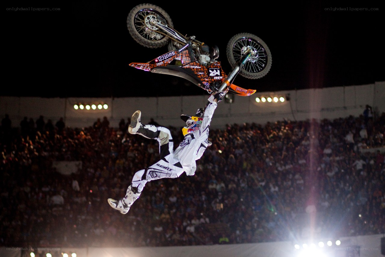 Motorcycle stunt performer in mid-air