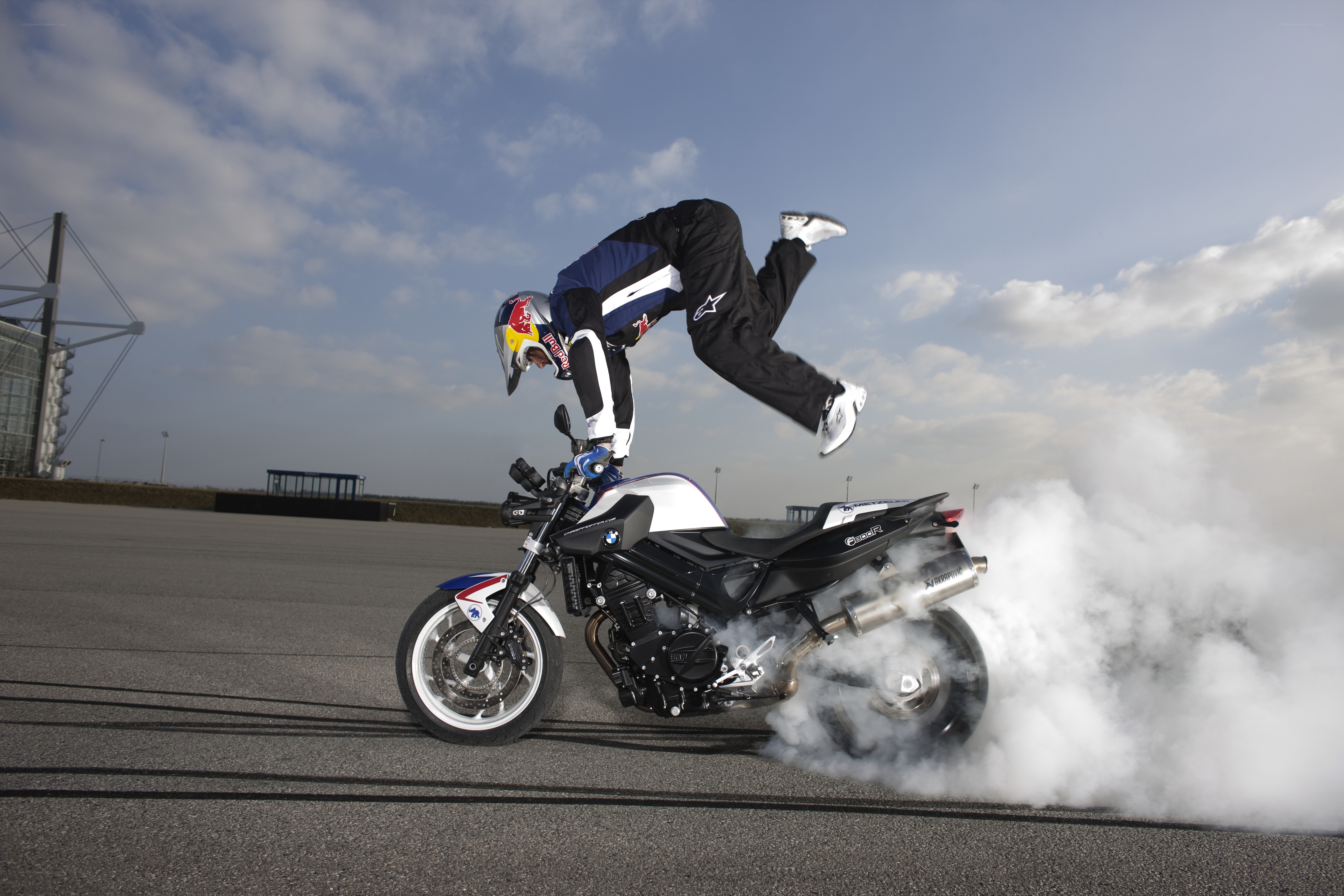 motorcycle stunt with smoke