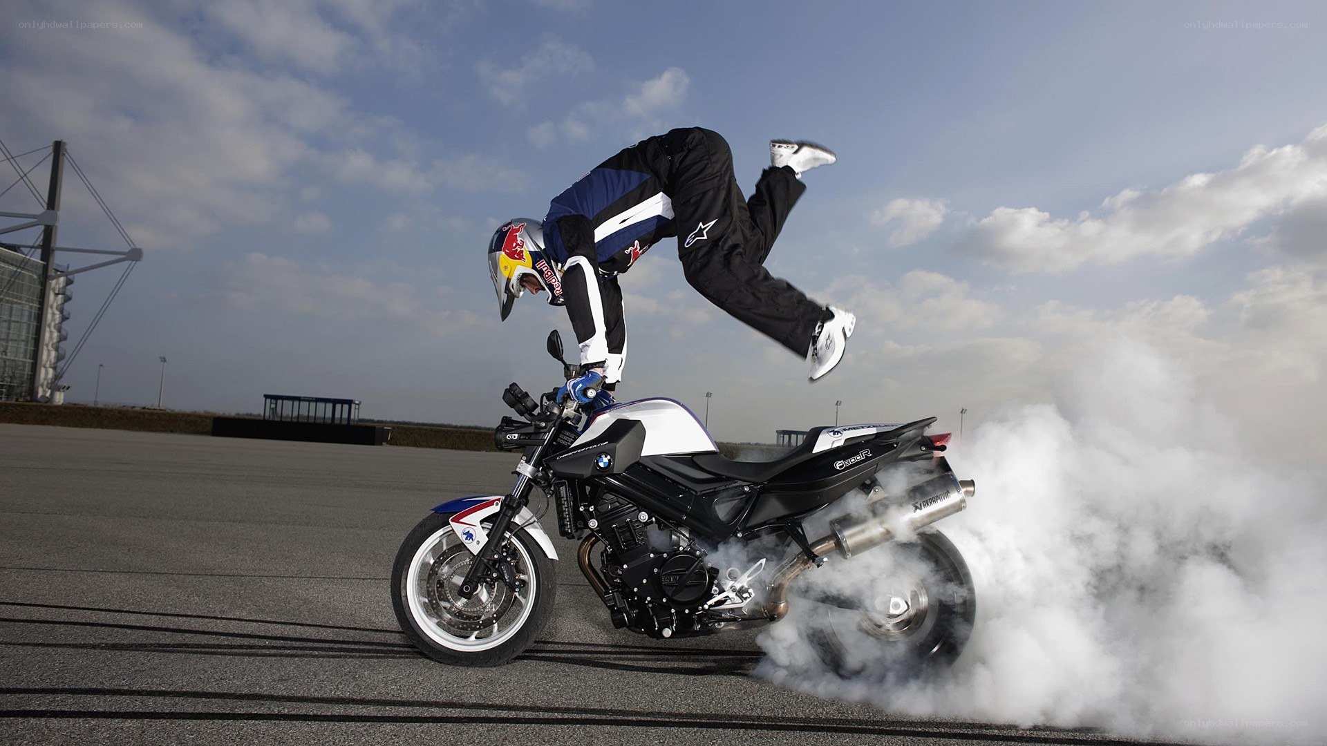 Motorcycle stunt with smoke