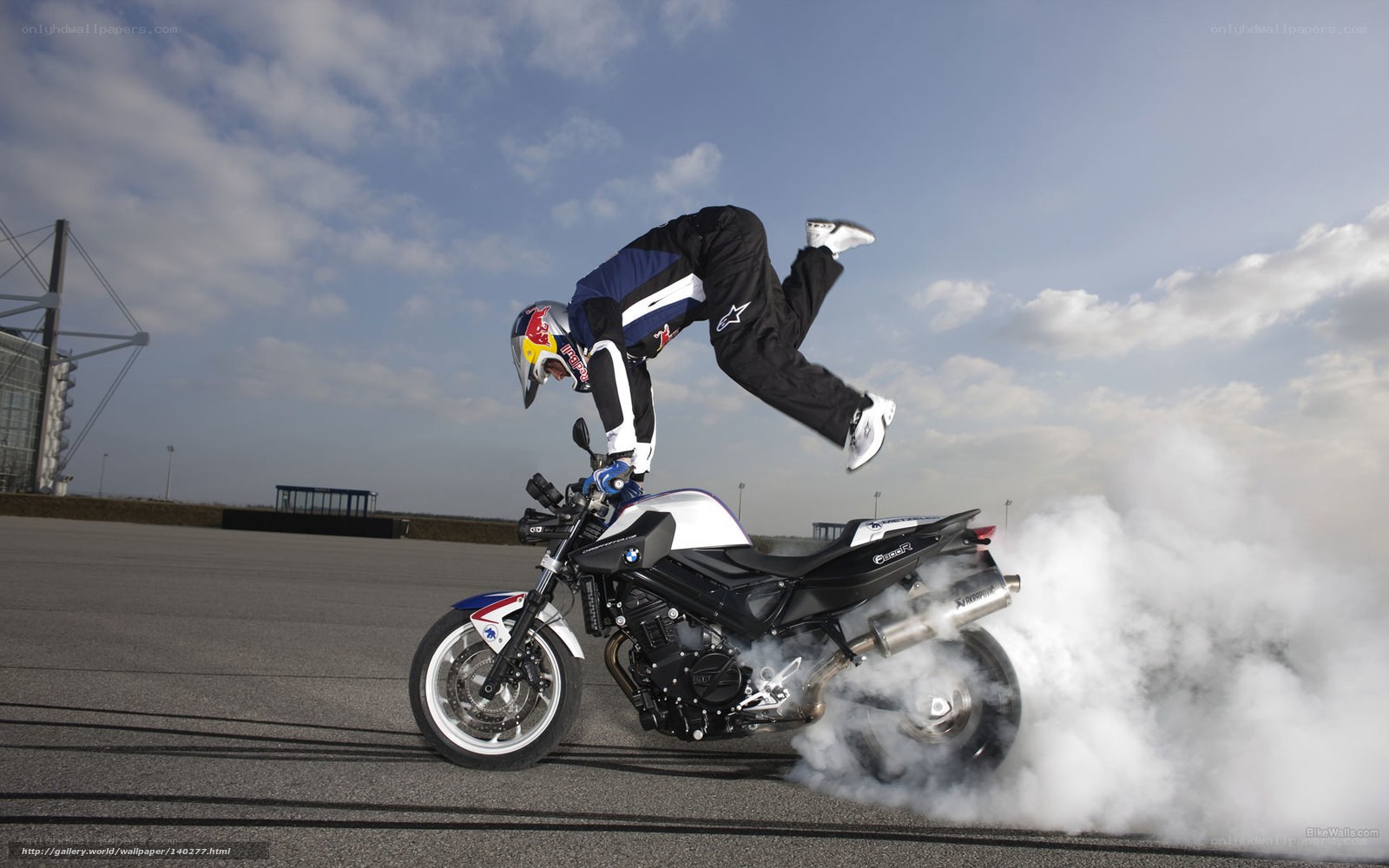 motorcycle stunt with smoke