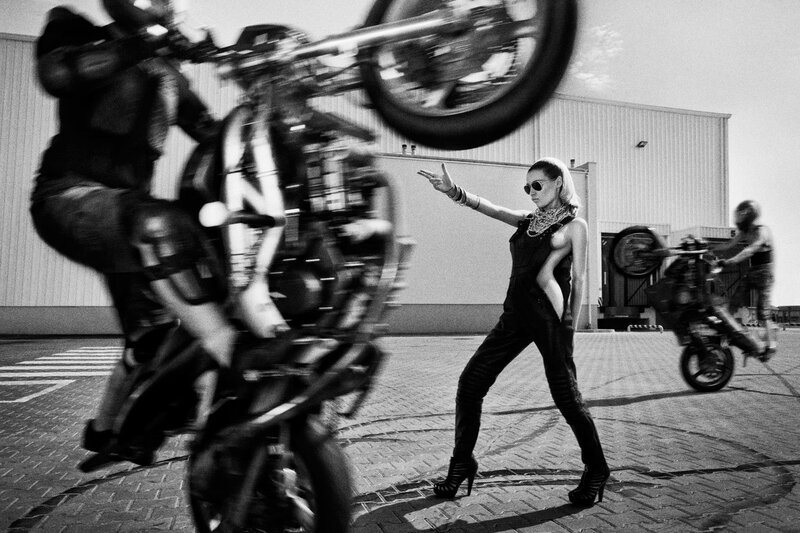 Motorcycle stunt with woman in center