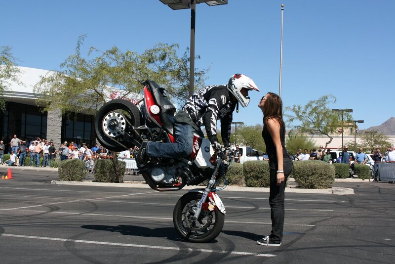 Motorcycle stunt with woman