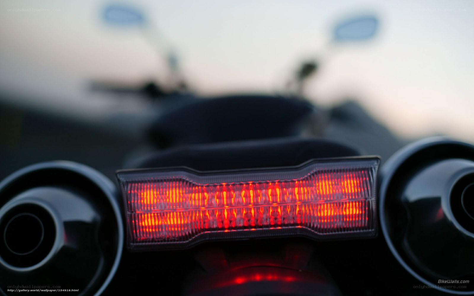 motorcycle tail light at dusk