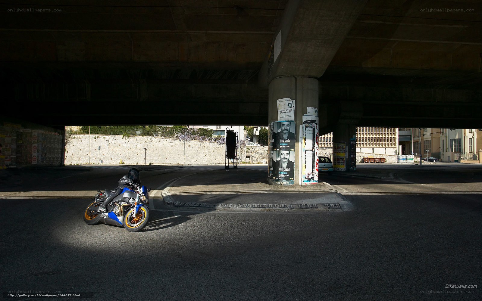 Motorcycle under a bridge