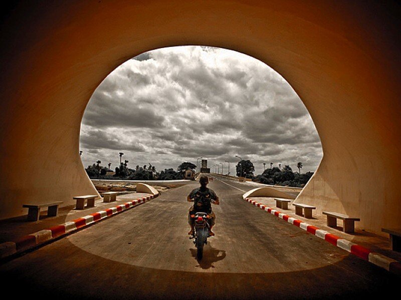 Motorcycle under a tunnel arch