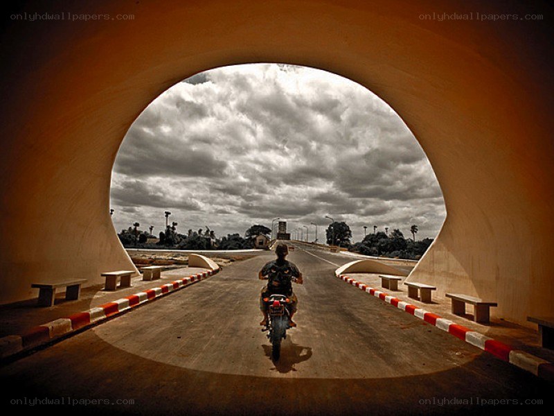 Motorcycle under a tunnel arch