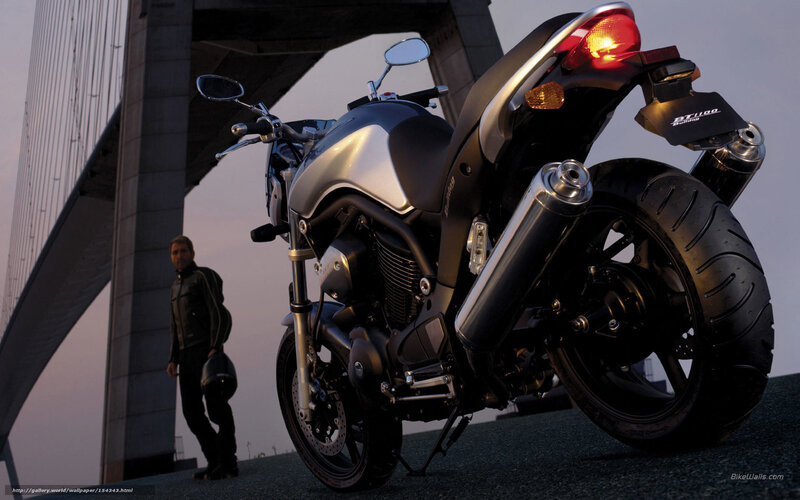 motorcycle under bridge at dusk