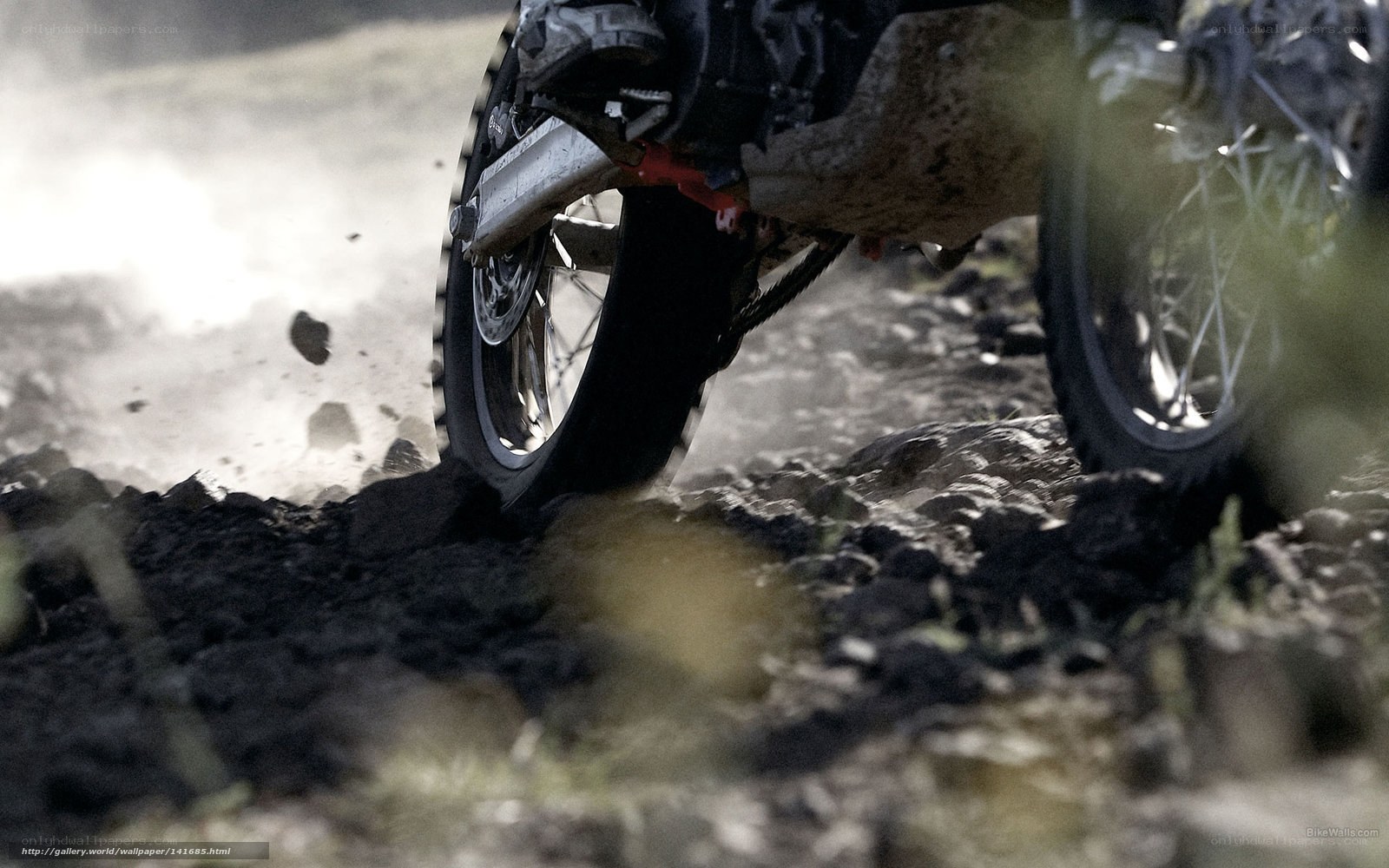 motorcycle wheel on rocky terrain