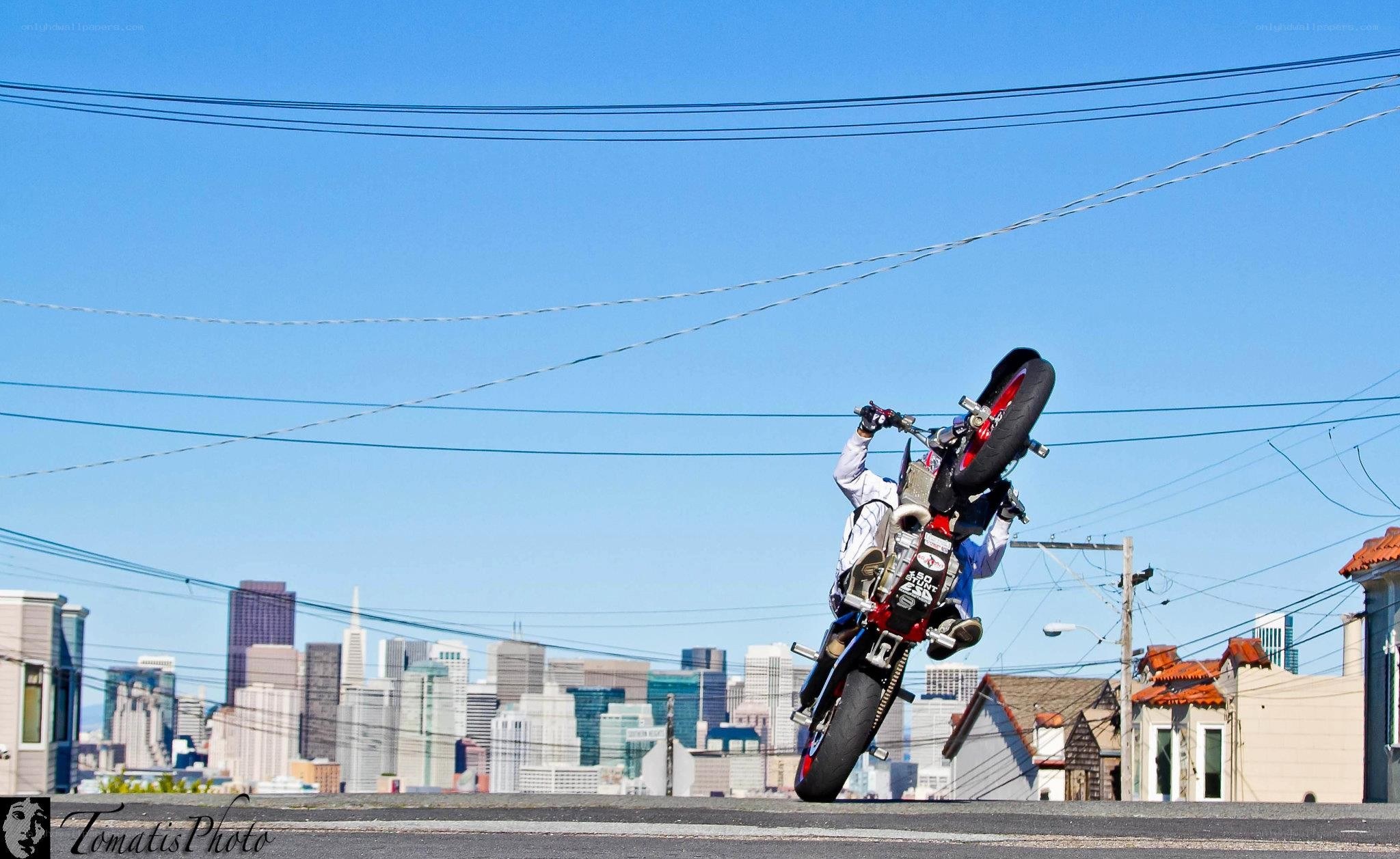 Motorcycle wheelie in city